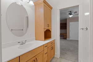 Bathroom with vanity and ceiling fan
