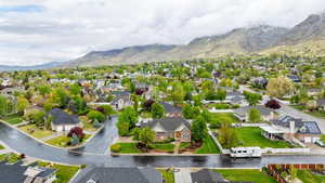 Drone / aerial view with a residential view and a mountain view