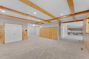 Interior space with stairs, beam ceiling, baseboards, recessed lighting, and carpet