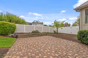View of patio / terrace with a fenced backyard and a gate