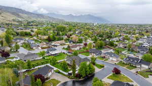 Birds eye view of property featuring a mountain view and a residential view
