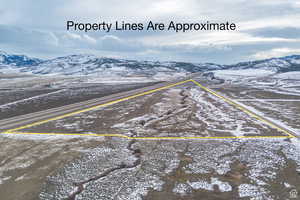 Snowy aerial view with a mountain view
