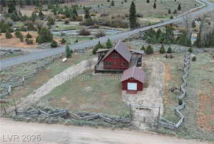 Birds eye view of property with a rural view