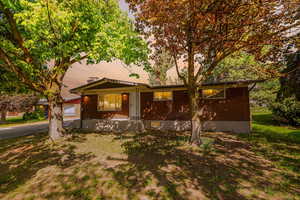 Ranch-style home with brick siding