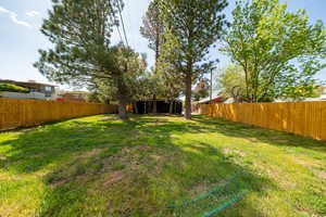 View of yard with a fenced backyard