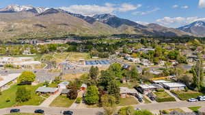 Birds eye view of property with a residential view and a mountain view