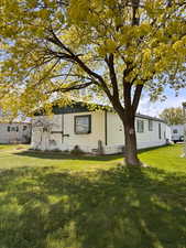 View of home's exterior featuring a lawn