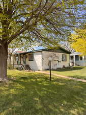 Single story home featuring a front yard