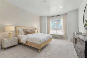 Bedroom featuring recessed lighting, baseboards, and light colored carpet