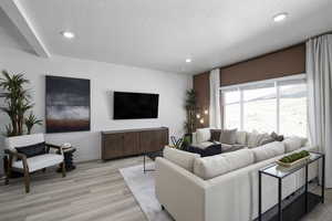 Living area with light wood-style floors, recessed lighting, a textured ceiling, and baseboards