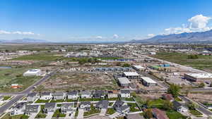 Birds eye view of property with a residential view and a mountain view