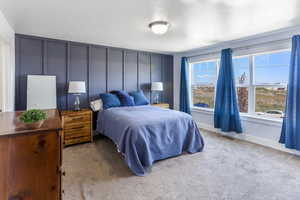 Bedroom with carpet flooring and baseboards