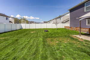 View of yard with fence and a residential view