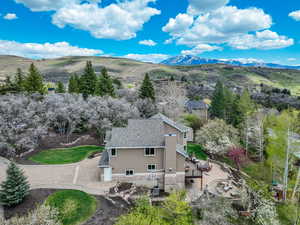 Birds eye view of property with a mountain view