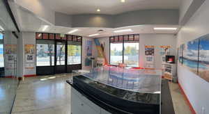 Interior space with recessed lighting, finished concrete flooring, and baseboards