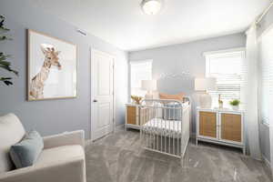 Bedroom with baseboards, multiple windows, carpet flooring, and visible vents