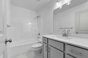 Bathroom featuring vanity, shower / bathtub combination, toilet, and marble finish floor