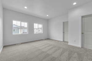 Unfurnished bedroom featuring recessed lighting, baseboards, visible vents, and carpet