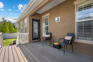 Deck featuring fence and a mountain view