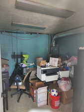 Garage featuring concrete block wall