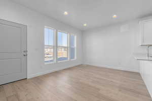 Interior space featuring recessed lighting, baseboards, and light wood-style floors