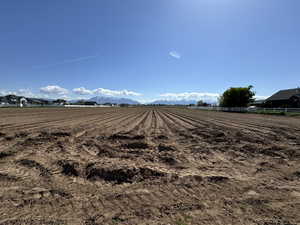 Exterior space with fence and a rural view