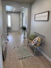 Entryway featuring baseboards and hardwood / wood-style floors