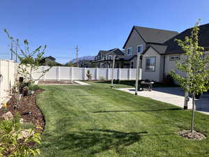View of yard with a patio, a residential view, and a fenced backyard