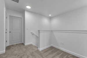 Walk in closet featuring carpet floors and visible vents