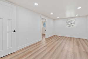 Interior space featuring light wood-style floors, baseboards, and recessed lighting