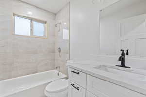 Full bath with vanity, bathing tub / shower combination, and toilet