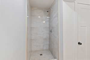 Full bath with tiled shower