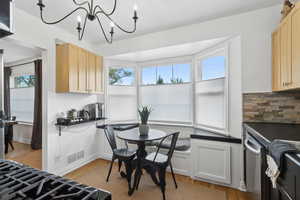 Eat in kitchen with built in storage bench.