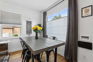 Dining room with baseboards and hardwood floors