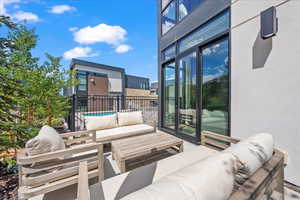 View of patio / terrace with a fenced in pool and an outdoor hangout area