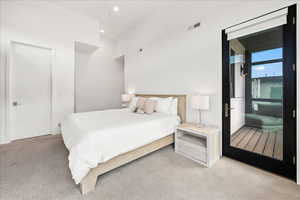 Carpeted bedroom featuring visible vents and recessed lighting