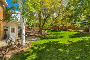 View of yard featuring a patio and a fenced backyard
