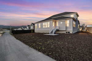 View of front of house featuring fence