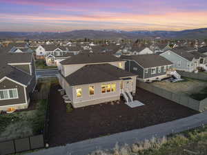 Aerial view at dusk with a residential view and a mountain view