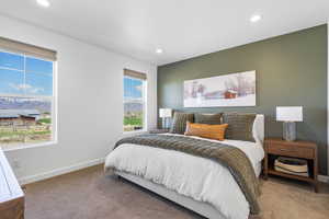 Carpeted bedroom with recessed lighting and baseboards