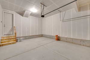 Garage featuring a garage door opener