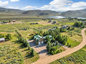 Bird's eye view with a rural view and a water and mountain view