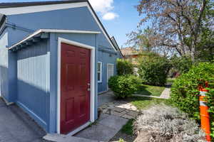 View of outdoor structure featuring an outbuilding