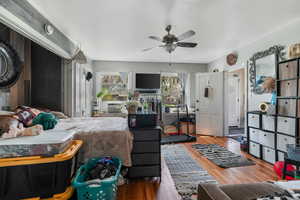 Bedroom featuring a ceiling fan and wood finished floors