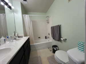 Bathroom featuring a sink, tile patterned floors, toilet, and visible vents
