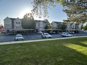 Partially covered parking lot with a residential view