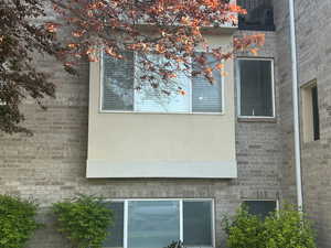 View of side of property featuring stucco siding