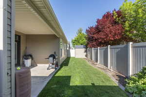 View of yard with a patio and a fenced backyard