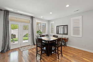 Dining space featuring recessed lighting, wood finished floors, and visible vents