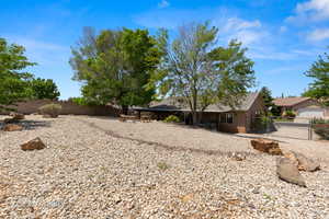 View of yard with a gate and a fenced backyard